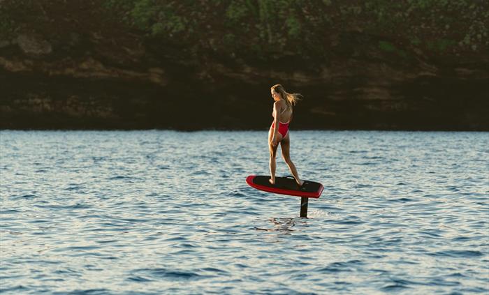 Girl riding efoil